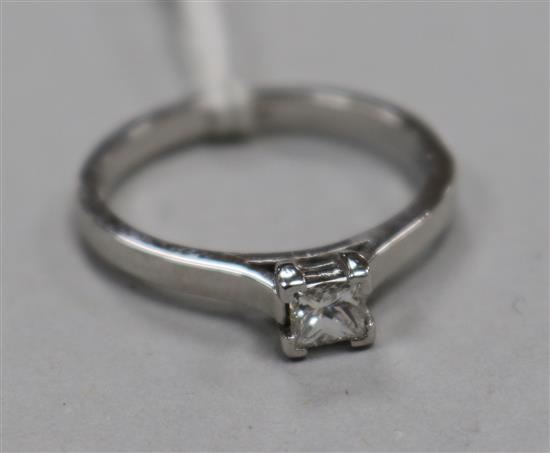 A modern platinum and solitaire princess cut diamond ring, size N.